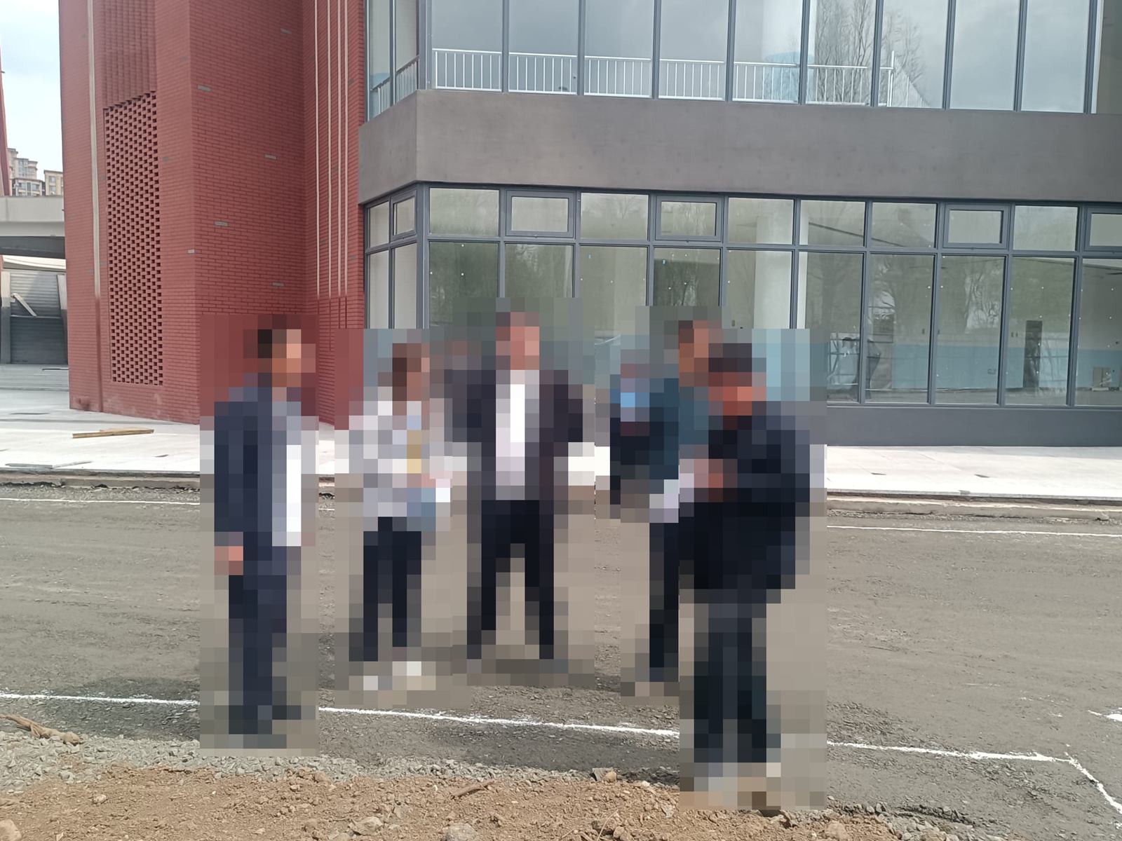 Fushun Experimental Middle School — Checking the setting-out beside the brick stair tower.